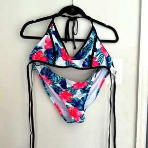 NWT.  Xhilaration two piece bathing suit with two tops. Size XL.